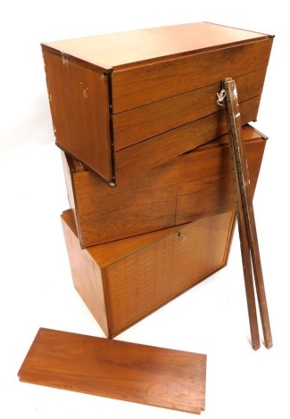 A 1970's Danish style teak modular unit, comprising cocktail cabinet with parquetry door and separate units with drawers and doors, 81cm wide.