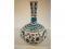 An Isnik pottery bottle vase painted in shades of blue and turquoise with