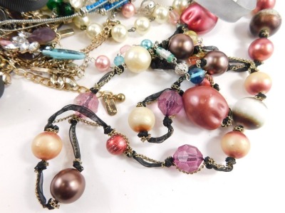 A group of modern costume jewellery, comprising chunky beaded and wooden necklaces, faux pearl necklaces, crystal style necklaces, etc. (a quantity) - 2