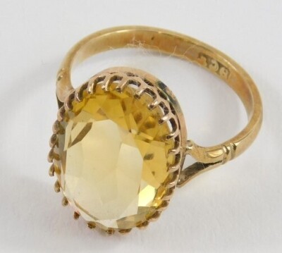 A 9ct gold and citrine ring, with oval claw set stone on part pierced shank, size L. - 2