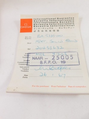 A Omega cocktail watch, with shaped square face, with 0.8cm dial, baton pointers, mother of pearl coloured face, black leather bracelet with gilt coloured mounts, in fitted case with outer box, paperwork and original receipt dated 1967 for £265. - 4