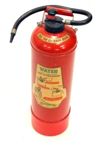 A vintage Minimax fire extinguisher, in red with black trim, 69cm high.