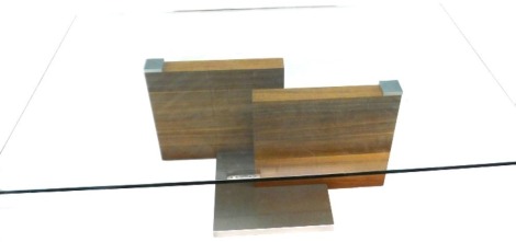 A retro teak metal and glass coffee table, of rectangular form, with a stepped centre section, 40cm high, 120cm wide, 77cm deep.