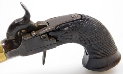 A 19thC travelling pistol, with percussion box lock, brass bell mouth, and brass patch pocket with hinged lid, with hidden trigger, unmarked, 18cm long. (AF) - 5