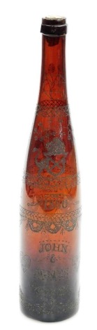 A Victorian brown glass bottle, with acid etched decoration depicting Grantham Church, crown and initial VR, the reverse etched with the names John and Agnes Dawson and the date 1880, the body further decorated with bands of line and cross decoration, etc