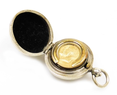 A George V full gold sovereign dated 1912, and a silver plated sovereign case.