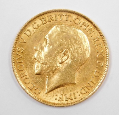 A George V full gold sovereign dated 1912, and a silver plated sovereign case. - 3