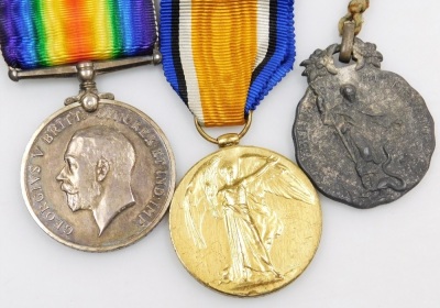 A World War I medal duo, comprising victory and campaign medals, awarded to Pte. J.P. Simms. 306516, Tank Corps, together with a tie clip and a pewter religious medallion with raised decoration. - 2