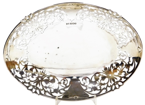 An Elizabeth II silver bon bon dish, of oval form, with pierced floral decoration, Walker and Hall, Sheffield 1960, 10.88oz, 23cm wide.