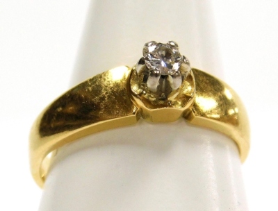 A diamond solitaire ring, yellow metal, in a high claw setting, approximately ¼ct, size M, 4.0g.