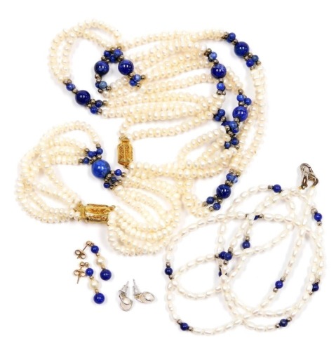 A pair of gold pearl and lapis lazuli drop earrings, further pair of earrings, two strand fresh water pearl and lapis lazuli necklace, on a plated clasp, further necklace and a four strand bracelet.