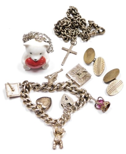 A Lladro porcelain teddy bear and heart pendant on a plated chain, silver curb link charm bracelet, with six charms as fitted, on a heart shaped padlock clasp with safety chain, a pair of oval chain link cufflinks, with engine turned decoration and a silv