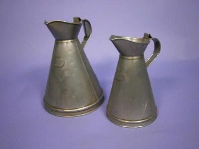 A graduated pair of tin measures for one gallon and half gallon