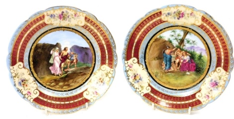 A pair of late 19thC Vienna style porcelain plates, painted centrally with mythological scenes, within gilt tooled red and turquoise banded borders, with reserves decorated with flowers, painted marks, 19cm wide. (AF)