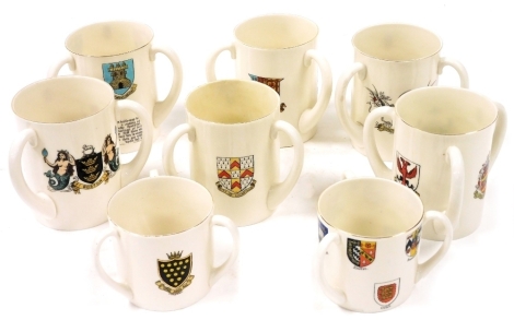 Eight Goss tyg form tankards, decorated with the arms of the city of Litchfield, Milton, Boston, Cornwall, Stow on the Wold, City of London, the Isle of Wight, and Oxford and it's colleges.