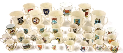 Goss and other crested china small and miniature tygs, including Oxford and Aberdeen Universities, Whitby, City of Bristol, and Ayr. (a quantity)