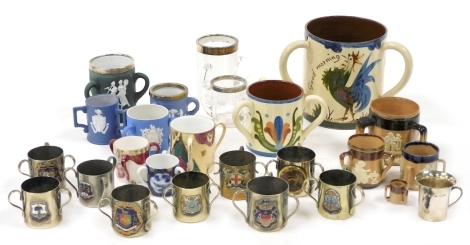 A group of ceramic glass and plated tygs, including a cut glass tyg with silver collar, an Aller Vale tyg decorated with a cockerel and 'Good Morning', plated tygs bearing various city arms, and Doulton Lambeth stoneware two tone tygs, one decorated with 