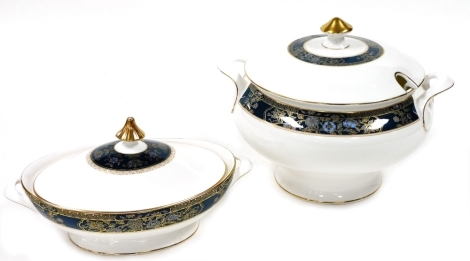 A Royal Doulton porcelain soup tureen and cover, decorated in the Carlyle pattern, together with a vegetable tureen and cover, latter seconds. (2)