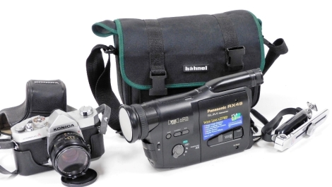 A Konica Autoreflex A camera, with a 52mm lens, cased, together with a Panasonic RX49 slim camcorder with x25 digital zoom, with carry case.