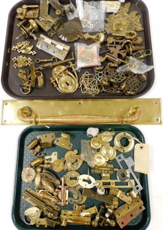 Door and window furniture, including locks, latches and bolts, together with a shop door handle. (a quantity)