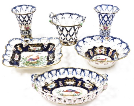 Six items of late 19thC Booths Blue Scale pattern basket weave pottery, decorated with reserves of exotic birds and flowers, comprising a pair of flared vases, 13cm high, oval, square and round baskets, and a twin handle basket. (6)