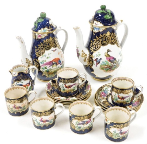 A late 19thC Booths Blue Scale pattern pottery part coffee service, decorated with reserves of exotic birds and flowers, comprising a pair of graduated coffee pots and covers, cream jug, six demitasse coffee cans, and eight saucers.