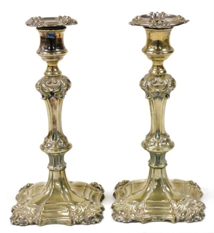 A pair of 19thC Elkington & Company silver plated candlesticks, of rococo form, 24cm high.