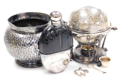 A group of silver plated items, to include a 19thC egg coddler or warmer, with a globe shaped roll top lid, with chased decoration, raised on four floral and scroll decorated supports and cylindrical under tier, 17cm high, a hip flask with plated mounts a