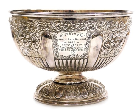 A 19thC electroplated Britannia metal punch bowl, repousse decorated with scrolls, leaves, repeat lion decoration, etc., engraved to the front 'AD.BN.First.P.V.P.C, Annual Rifle Meeting 1897 Presented by the New Egerton Woolen Mills Company Limited', and 