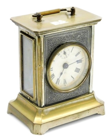 A German Junghans brass finish carriage clock, with paper Roman numeric dial and loop handle, 16cm high.