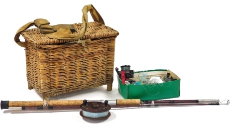 A group of fishing tackle, to include a wicker fishing basket, 28cm high, 38cm wide, 26cm deep, a Norman Sports International A260/S fishing rod, various reels, etc. (a quantity)