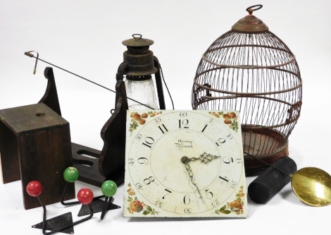 A Herring of Newark painted clock face, with Arabic numerals, bell strike, the face 31cm x 30cm, with pendulum, a wirework red painted bird cage, with ring handle, 46cm high, coat hooks, lamp, etc. (a quantity)