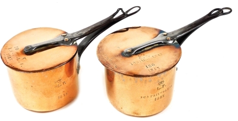 Two 19thC copper saucepans and lids, one engraved L.P with crown crest, Fontainebleau 1845, numbered 155 and the other L.P with crown crest and dated 1845, numbered 148, each pan 14.5cm diameter.