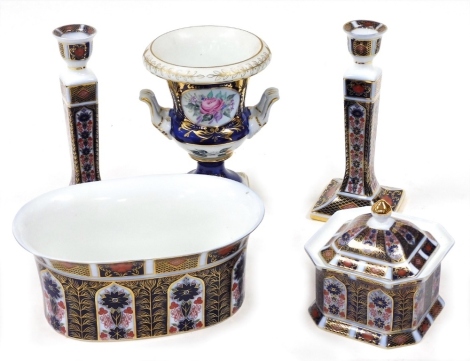 A group of Roselle Occ and Co Imari wares, comprising two candlesticks, 24cm high, oval dish, 25cm wide, jar and cover, 14cm high, and a two handled vase, decorated with flowers with gilt highlights against a blue and white ground, 20cm high.