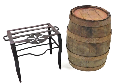 A Victorian cast iron footman, 42cm wide, together with an oak and iron bound barrel, the top stamped SV Co., 43cm high. (2)