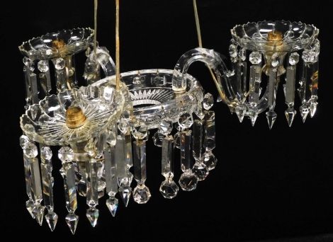 A late 19thC or early 20thC cut glass chandelier, each with 'S' shaped arms and drops and another matching, incomplete.