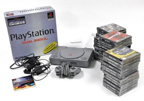 A Sony Playstation Dual Shock, boxed, together with assorted games, including Final Fantasy, Driver, Smack Down, and Cool Boarders. (a quantity)