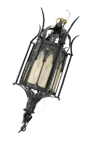 A Victorian Gothic style wrought iron hanging lantern, of hexagonal form, inset glass panels, 62cm high.