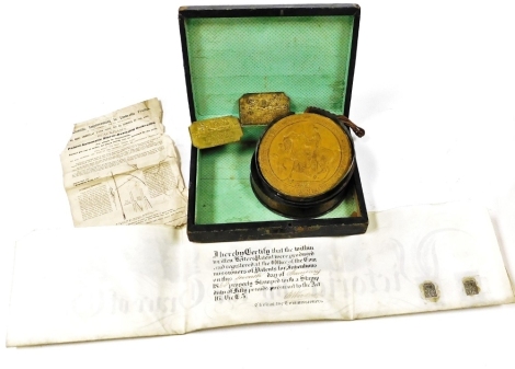 A Victorian grant of patent, to Joseph Josiah Blackham for the invention of 'certain improvements in brooch or other like fastenings', with wax seal, dated 1865, together with two patentee brass plaques named to the same, and an advert for Blackham's pate