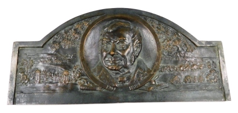 A bronze memorial plaque to the politician and social reformer Joseph William Livesey (1794-1884), embossed with a circular portrait of the gentleman against a back drop of a garden and landscape, signed WN Simm/32, 49.5cm wide.