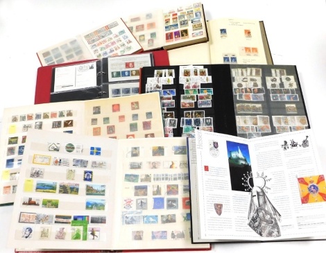 Philately: Germany; Third Reich, postcards and commemoratives, GDR and FRG definitives and commemoratives and German Unification stamps, in six albums and a stock book.