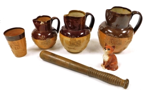 Three 19thC Doulton Lambeth two tone stoneware harvest jugs, together with a two tone beaker, Beswick figure of a seated cat, and a police truncheon with a turned wooden handle. (6)