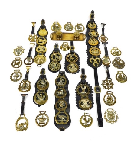 Horse brasses, some mounted on martingales, together with a Jugenstil brass desk stand. (a quantity)