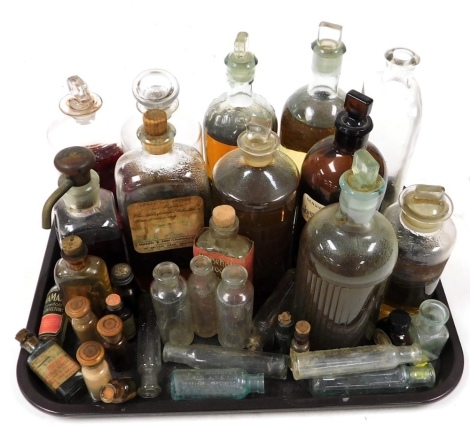 Antique and vintage chemist jars and bottles, an acid bottle, a poison bottle, some containing contents. (a quantity)