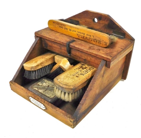 An early 20thC wooden shoe cleaning box, bearing label for Fredk. Baker and Company, Lee Green, containing brushes, etc.