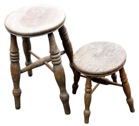 A 19thC elm milking stool, raised on turned legs, united by an H frame stretcher, and a further stool. (2)