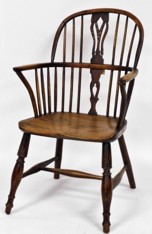 A 19thC yew and elm Windsor chair, by Amos, Grantham, with a pierced vase shaped splat, solid saddle seat, raised on turned legs united by an H framed stretcher.