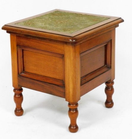 A Victorian walnut commode, with a wool work set hinged lid, opening to reveal a fitted interior, raised on turned legs, 50cm high, 46cm wide.