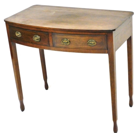 A 19thC mahogany and boxwood strung bow fronted side table, with two frieze drawers, on square tapering legs, 72cm high, 79cm wide, 44cm deep.