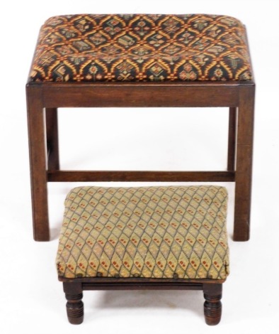 A Georgian style mahogany stool, with an upholstered drop in seat, raised on square legs united by a H frame stretcher, together with a Victorian mahogany and upholstered footstool, raised on turned legs. (2)